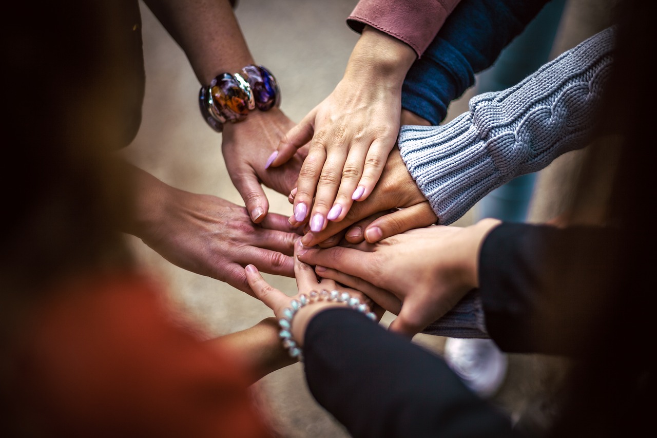 hands stacked together to show unity and team work